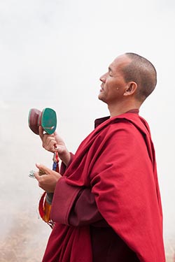A Monk Offering Prayer, Chimi Lhakhang, Bhutan